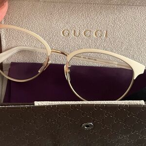Gucci prescription frames with eyeglass case and cloth to wipe lenses.